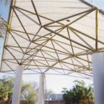 outdoor walkway covering view through trusses